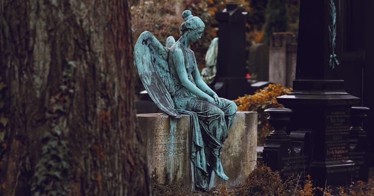 statue at a gravesite