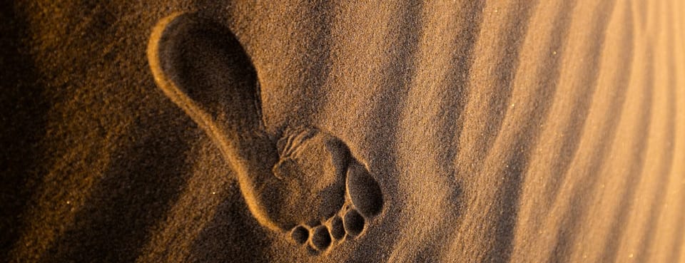 single footprint in sand